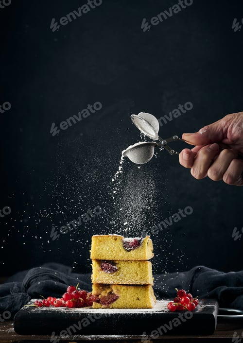 Preview: Stack of square slices of baked plum biscuit cake