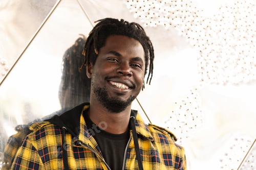 Preview: Portrait of a smiling young african man