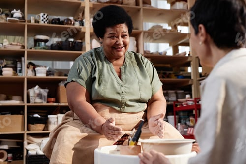 Preview: Senior Black Woman in Cozy Pottery Studio