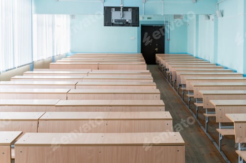 Preview: Empty Classroom with Rows of Wooden Desks