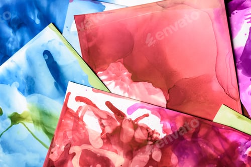 Preview: blue, red and green splashes of alcohol inks on paper sheets as abstract background