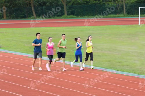 Preview: Group of friends running together outdoors