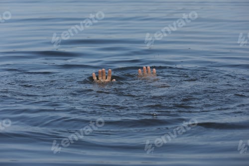 Preview: Drowning man reaching for help in sea, closeup
