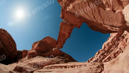 Preview: Exploring the stunning rock formations in Wadi Rum Desert, Jordan under a bright sun during midday