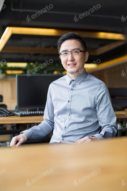 Preview: IT worker sitting in office
