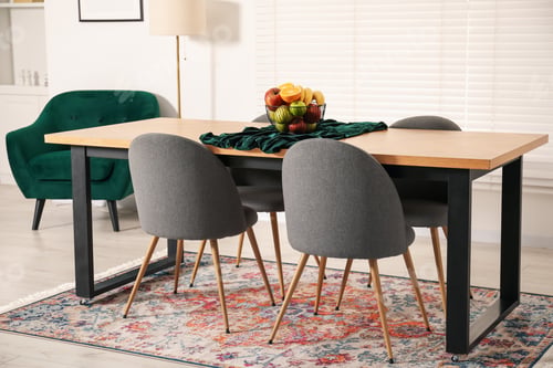 Preview: Bowl of fruits on wooden table in dining room. Interior design