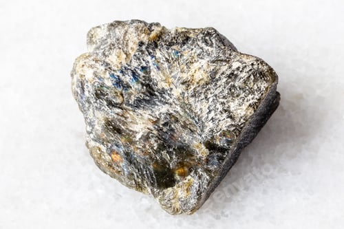 Preview: rough dark green labradorite mineral on white