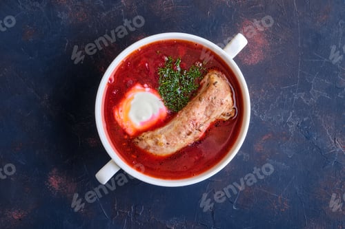 Preview: Top view of beet and tomato soup with beef rib and sour cream