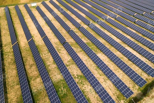 Preview: Aerial view of solar power plant. Electric panels for producing clean ecologic energy.