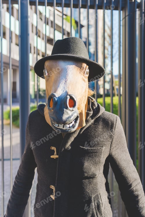 Preview: Young man wearing horse mask