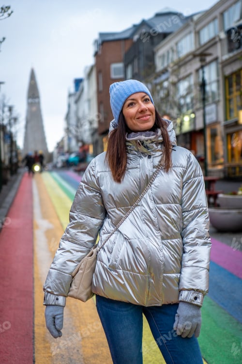 Preview: Woman with metallic jacket on Rainbow street in Reykjavik, Iceland