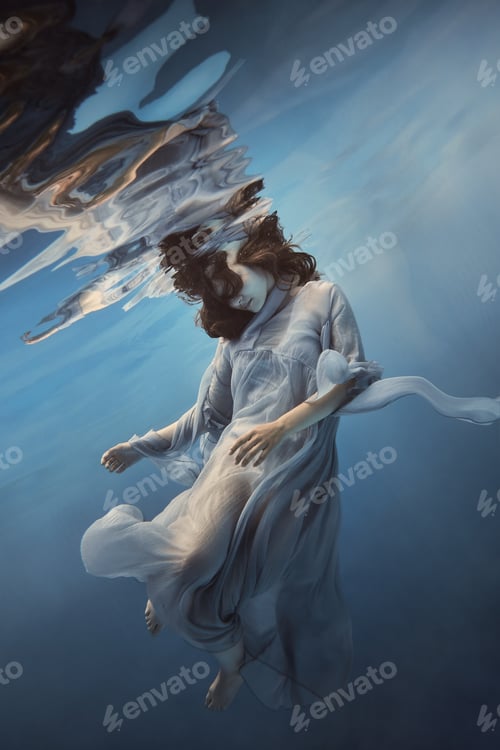 Preview: Portrait Of A Girl In A Blue Dress Under Water