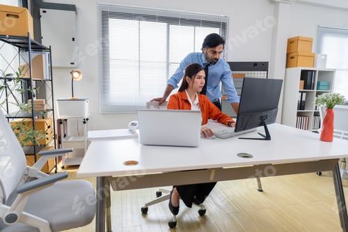 Preview: Business Professionals Discussing Project in Modern Office