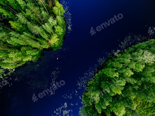 Preview: Aerial view of blue lake between green summer woods in Finland.
