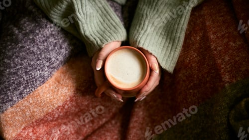 Preview: Close Up Looking Down On Woman At Home In Winter Jumper With Warming Hot Drink Of Coffee In Mug