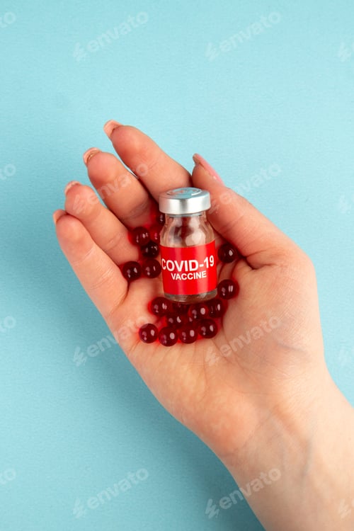 Preview: top view female hand with red pills on blue background hospital pandemic covid- lab virus cure drug
