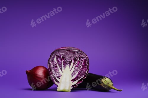 Preview: close-up view of sliced cabbage, onion and eggplant on purple background