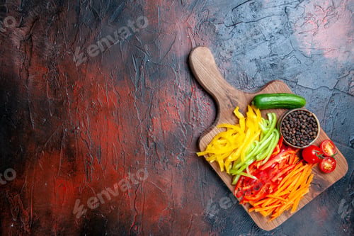 Preview: top view colorful cut peppers black pepper tomatoes cucumber on chopping board on dark red table