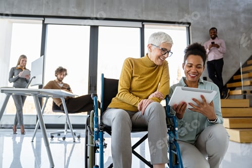 Preview: A diverse group of young professionals, including senior businesswomen entrepreneur in a wheelchair