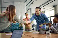 Preview: Business Professionals Celebrate a New Partnership in Office