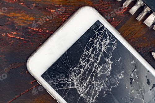 Preview: Smartphone repair concept. Damaged display of smartphone and tools