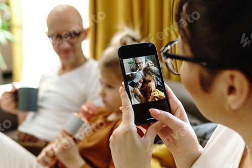 Preview: Little girl with a karaoke microphone singing for her parents