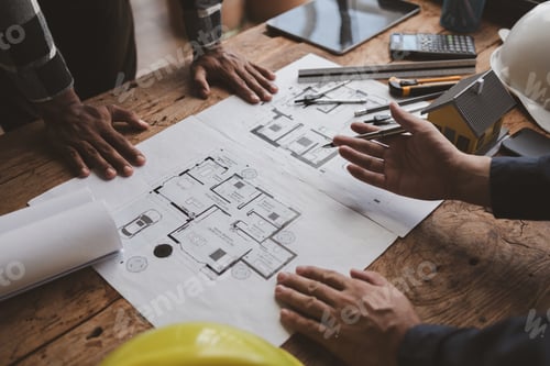 Preview: The home design architects are reviewing the house plan draft, the project commissioned by the clien