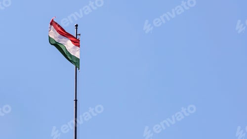Preview: Hungarian flag gently fluttering against bright blue sky