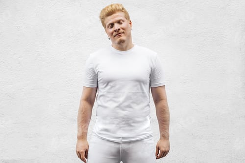 Vista previa: Monochrome: Portrait of an albino Latino man in white clothing against a white background.