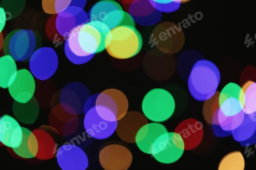 Preview: Beautiful colorful lights on dark background. Bokeh effect