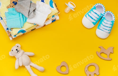 Preview: baby accessories for newborns on a colored background. selective focus.