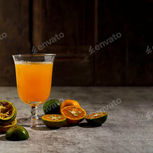 Preview: Warm Orange Juice on A Glass, Freh Made with Small Orange. Copy Space for Text or Advertisement