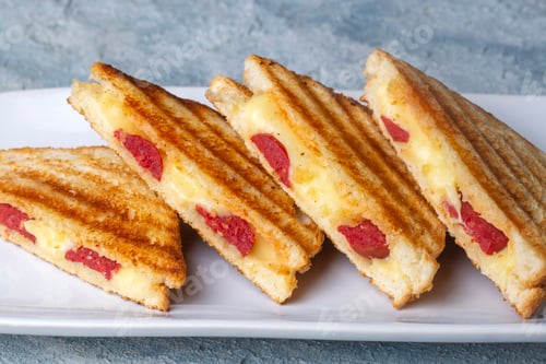 Preview: Turkish toast, mixed toast with cheddar cheese, sausage and ham, with fried potatoes. Karisik tost