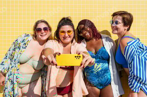 Preview: Group of plus size women with swimwear at the beach