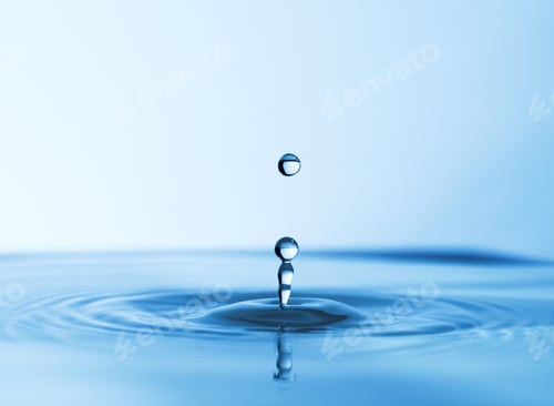 Preview: The source of life. Abstract studio shot of a water droplet falling into a puddle of water.
