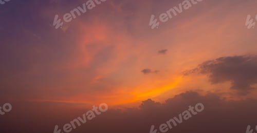 Preview: Sunset sky. Abstract nature background. Dramatic blue and orange, colorful clouds at twilight time.