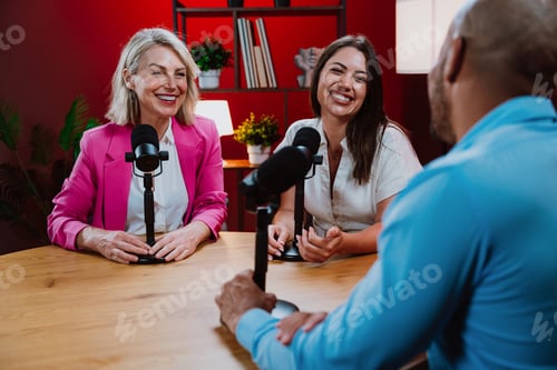 Preview: Content creators broadcasting live podcast interview using microphones