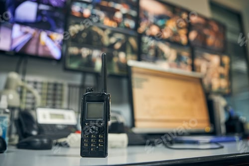 Preview: Walkie-talkie placed on an office desk in a control room