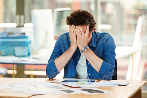 Preview: One of those days. Shot a frustrated designer sitting at his desk.