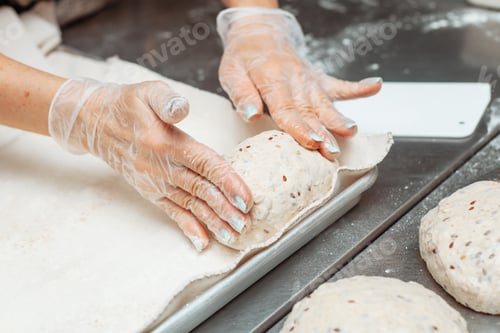 Preview: baker shaping dough for bread