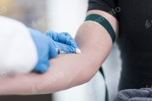 Preview: Doctor taking blood sample