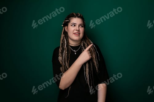 Preview: Woman With Dreadlocks Pointing at Something