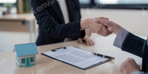 Preview: Real Estate Agent Shaking Hands with Client Over Contract in Office Setting with Model House and