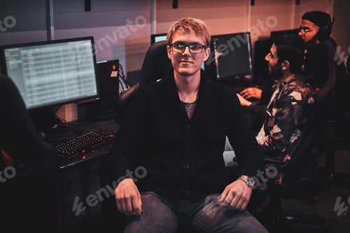 Preview: Portrait of young gamer at busy cyberclub