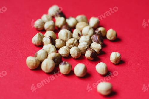 Preview: Hazelnut. Hazelnut on a red background. Nuts