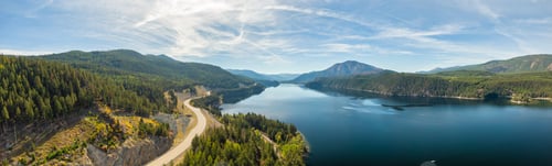Preview: Aerial panoramic view of a scenic highway around mountains