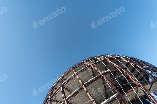 Preview: Unfinished sphere shape building, copy space. Construction of futuristic shopping mall or museum