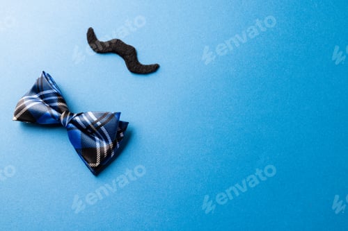 Preview: Fun Bow Tie and Mustache on Blue Background
