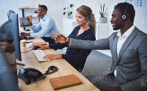 Preview: Happy caucasian female call centre telemarketing agent discussing plans with african american colle