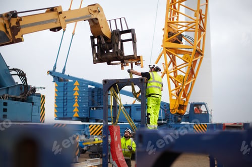 Wind Turbine Technicians Work on a Wind Farm
